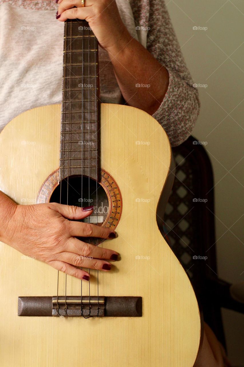 Woman holding a guitar