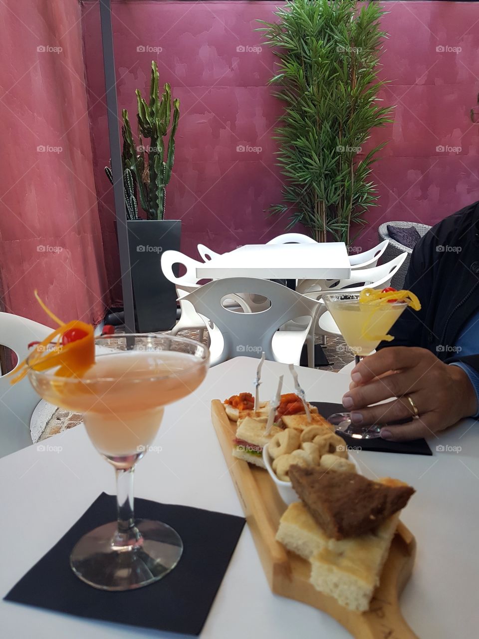 Cocktails and finger food at happy hour
