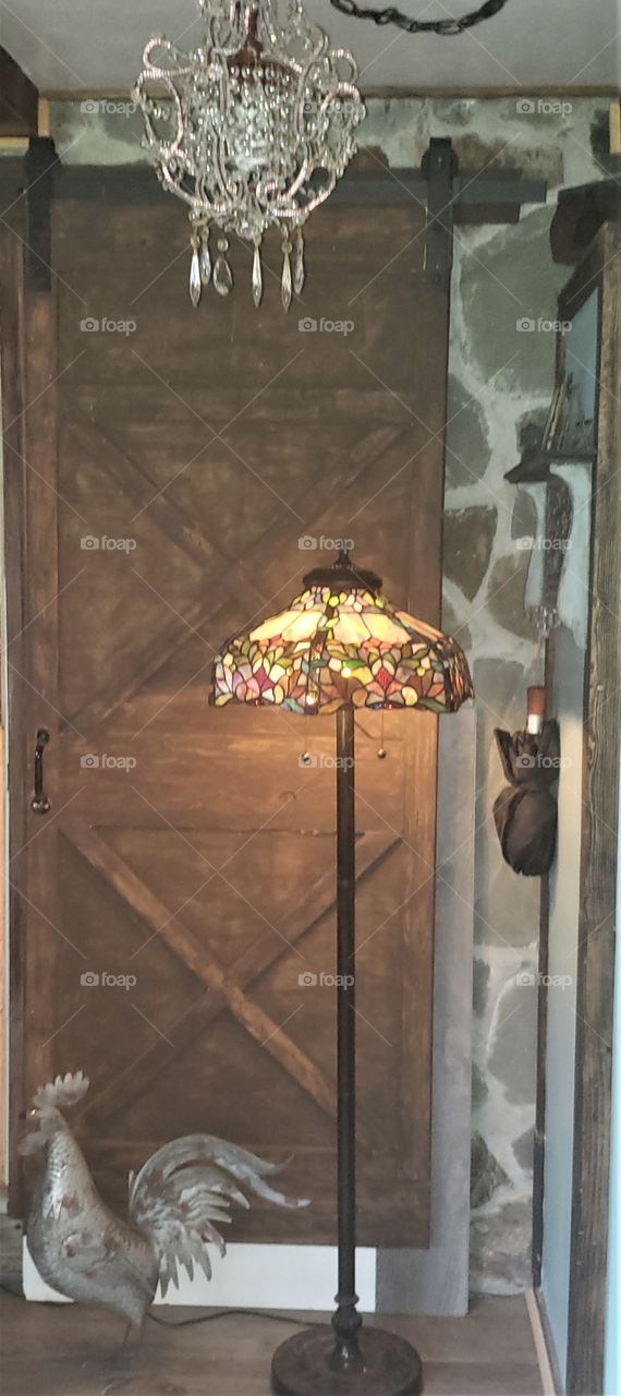 Tiffany Style Fllor Lamp in Front of a Sliding Barn Door & Rock Wall