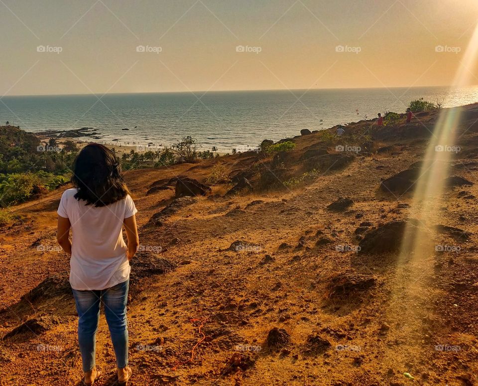 woman watching the sea during sunset 😍 I took this with my OnePlus smartphone...