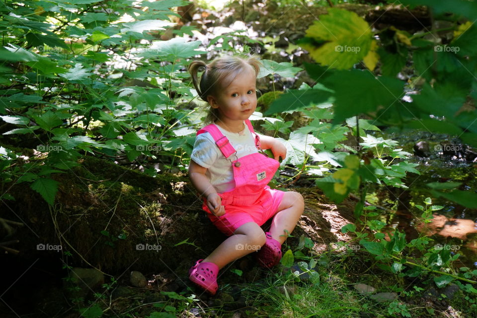 Hanging out. Toddler in the woods