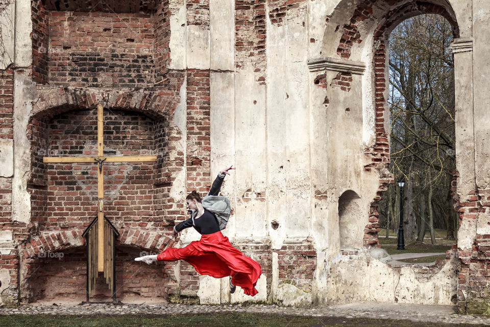 dancing lady in a park next to church