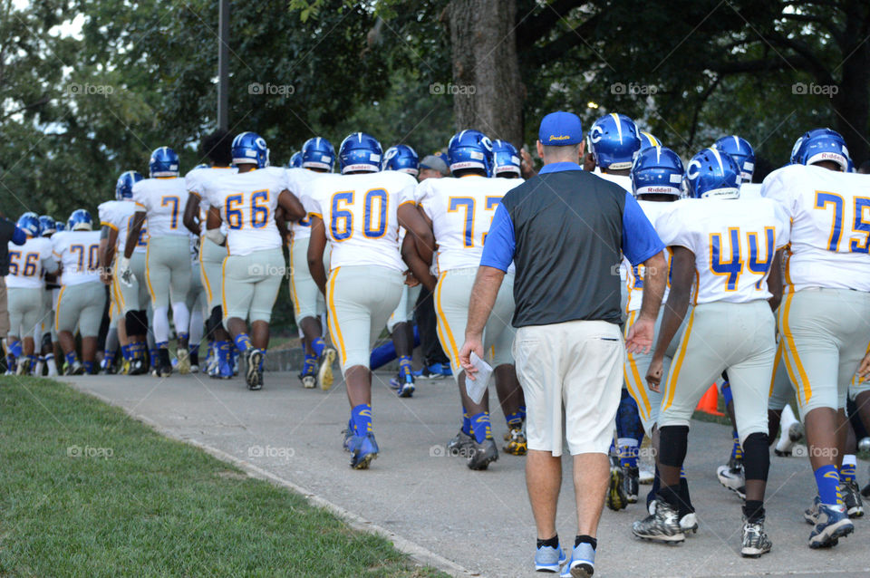 Walking out to the football field. 