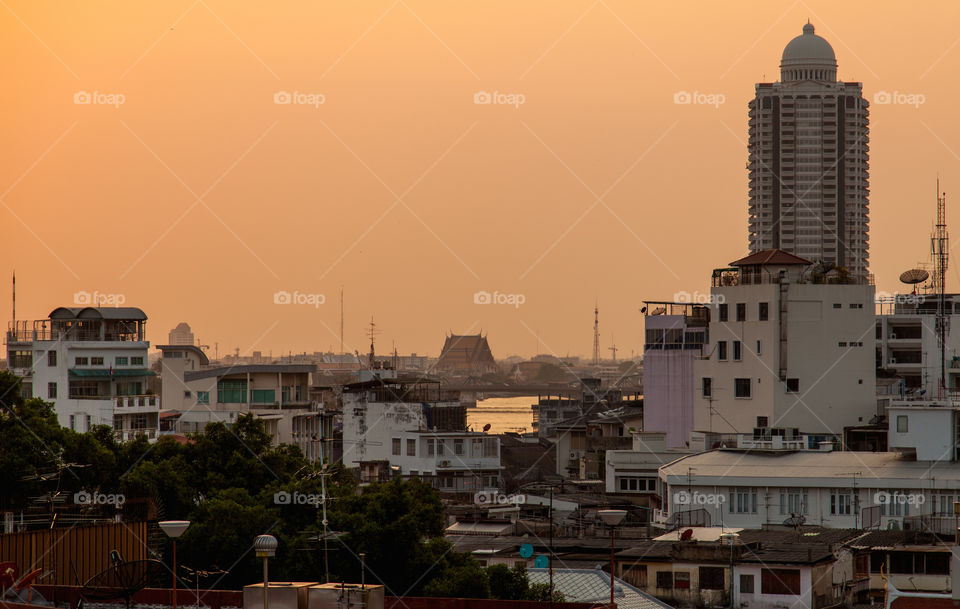 View on Chao Praya River. Bangkok is famous to become gold at sunset