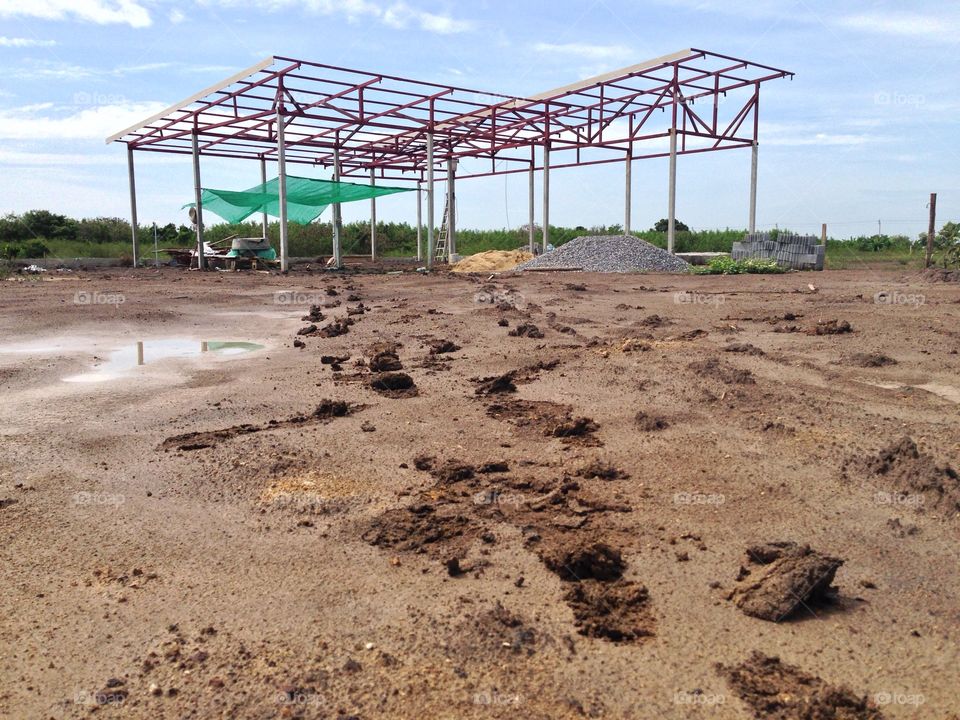 Muddy road and steel frame, work hard rain.