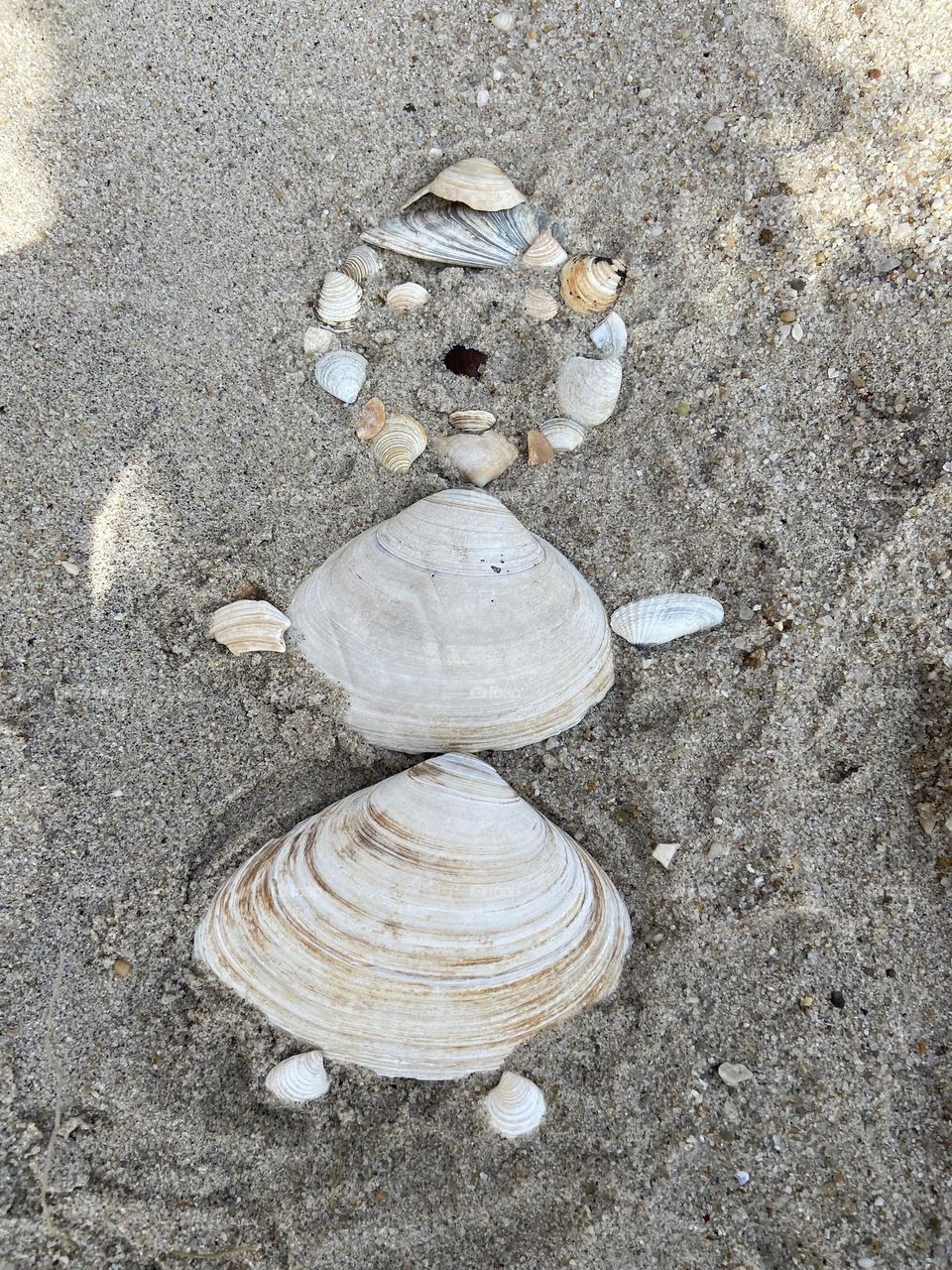 Seashell woman in the sand. Photo of a seashell woman I made while enjoying the morning at a beach in Lavallette, NJ. You’re never too old to play in the sand! Don’t forget to make time for fun! 