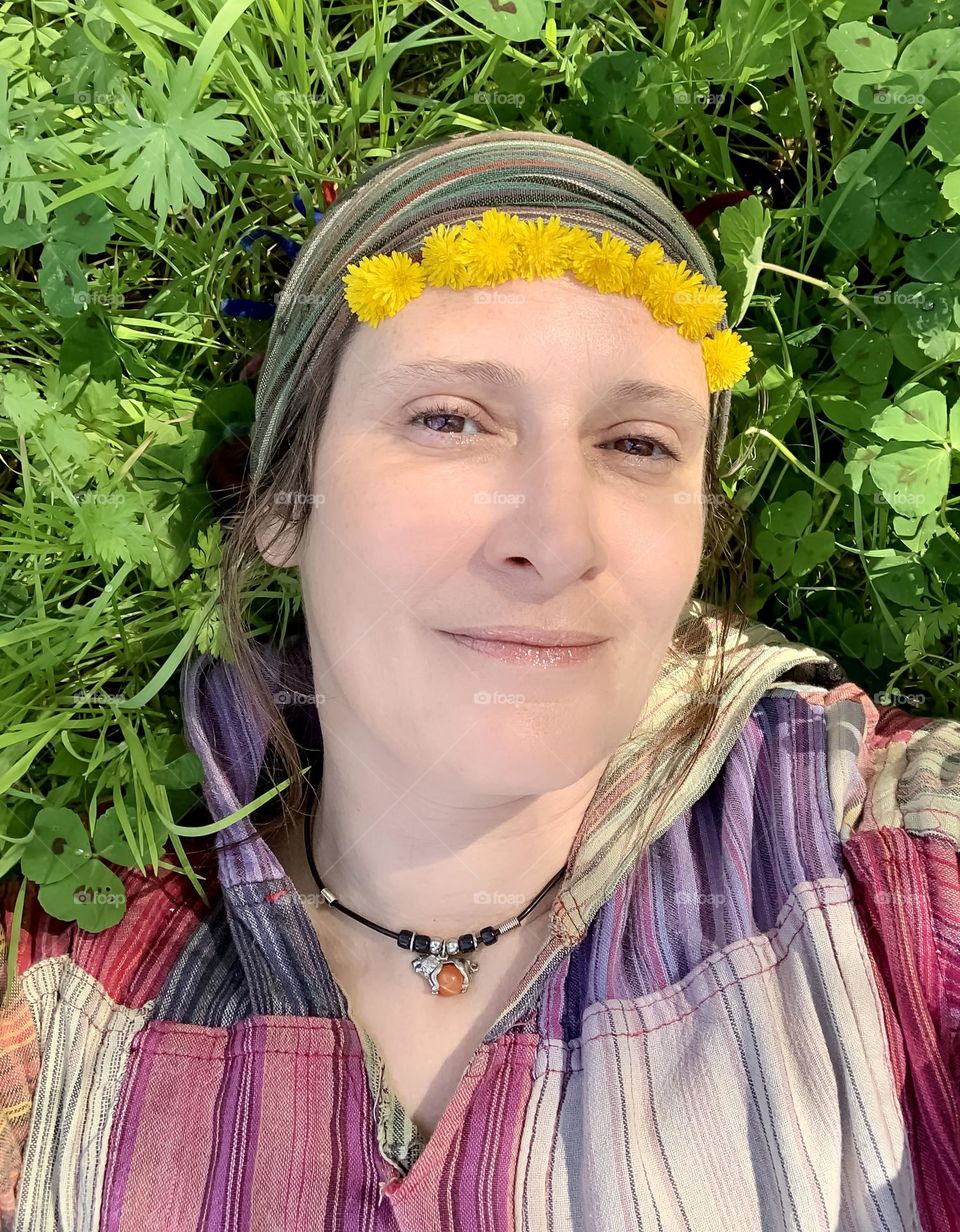 Self portrait in my hippy clothes, laying in the grass in the shade of trees