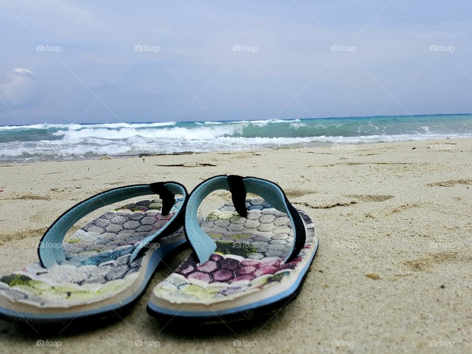 Slippers on a beach