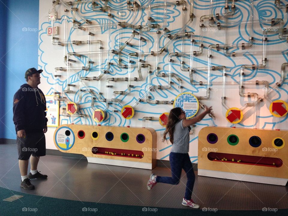 Child in science center activity, Predicting. Child in activity at science world Vancouver