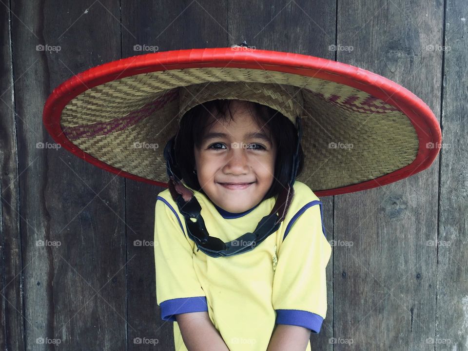 little girl wearing hat