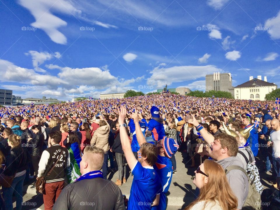 People whatching a soccer game in iceland