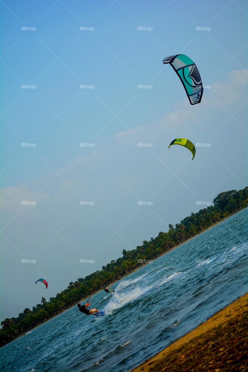 Sailors of the Wind: Kite Surfing Duo at Kandakuliya Beach