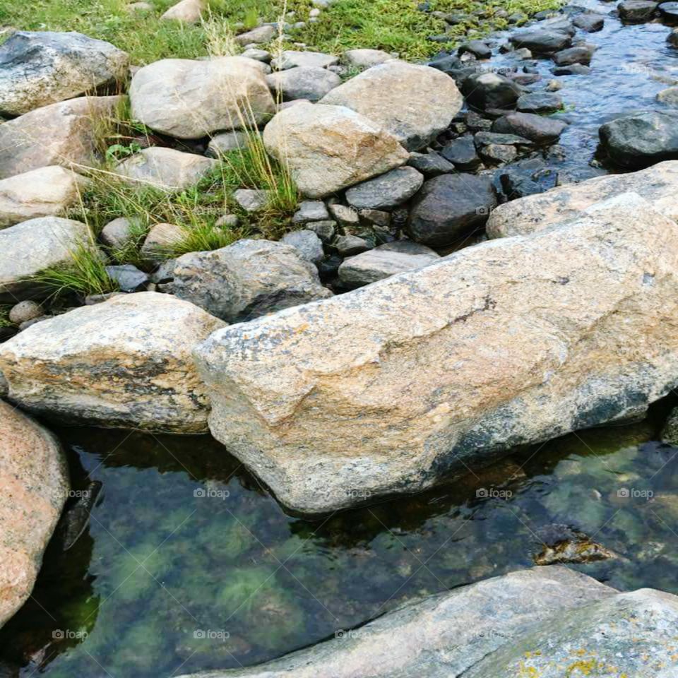 ROCKS BETWEEN WATER.