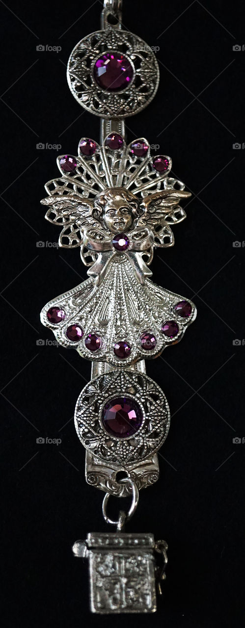 Silver filigree charm with purple glass beads