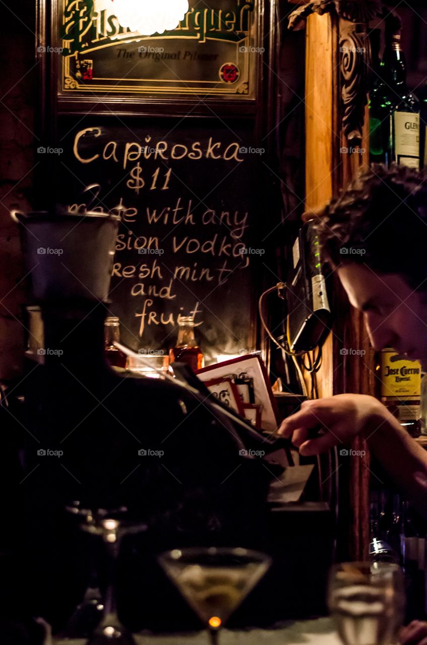 Young man sitting in the bar