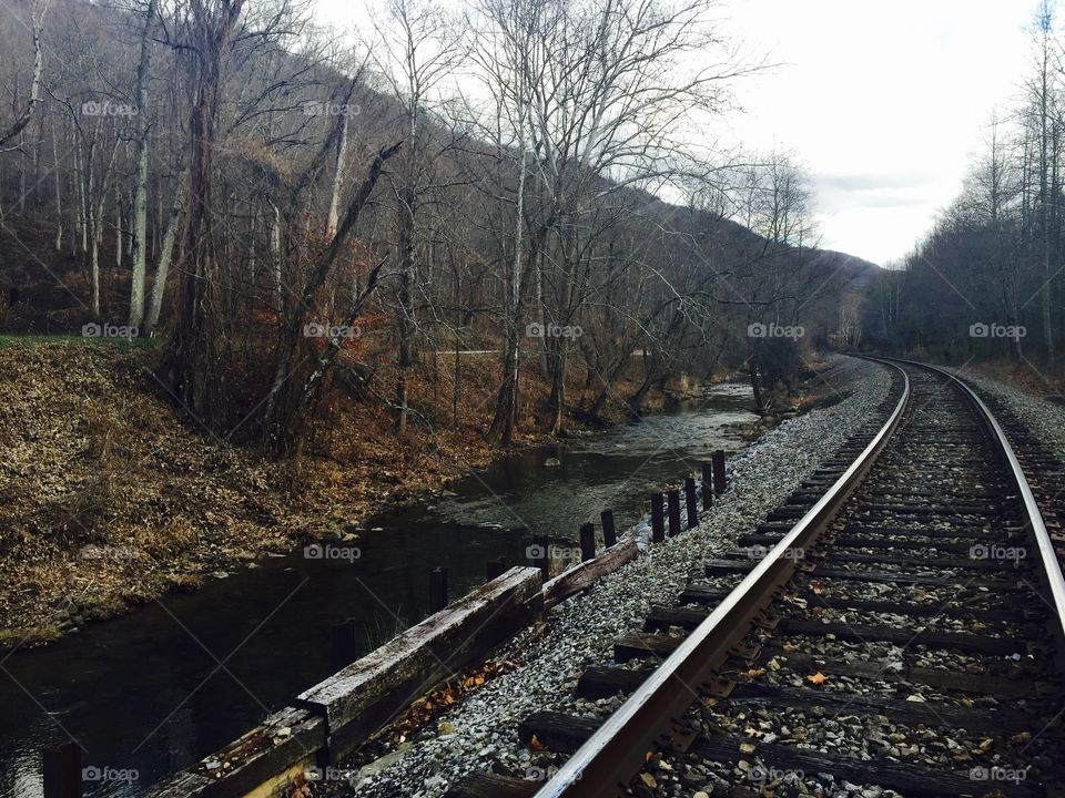 Train Tracks. Train tracks by the river on a cold day