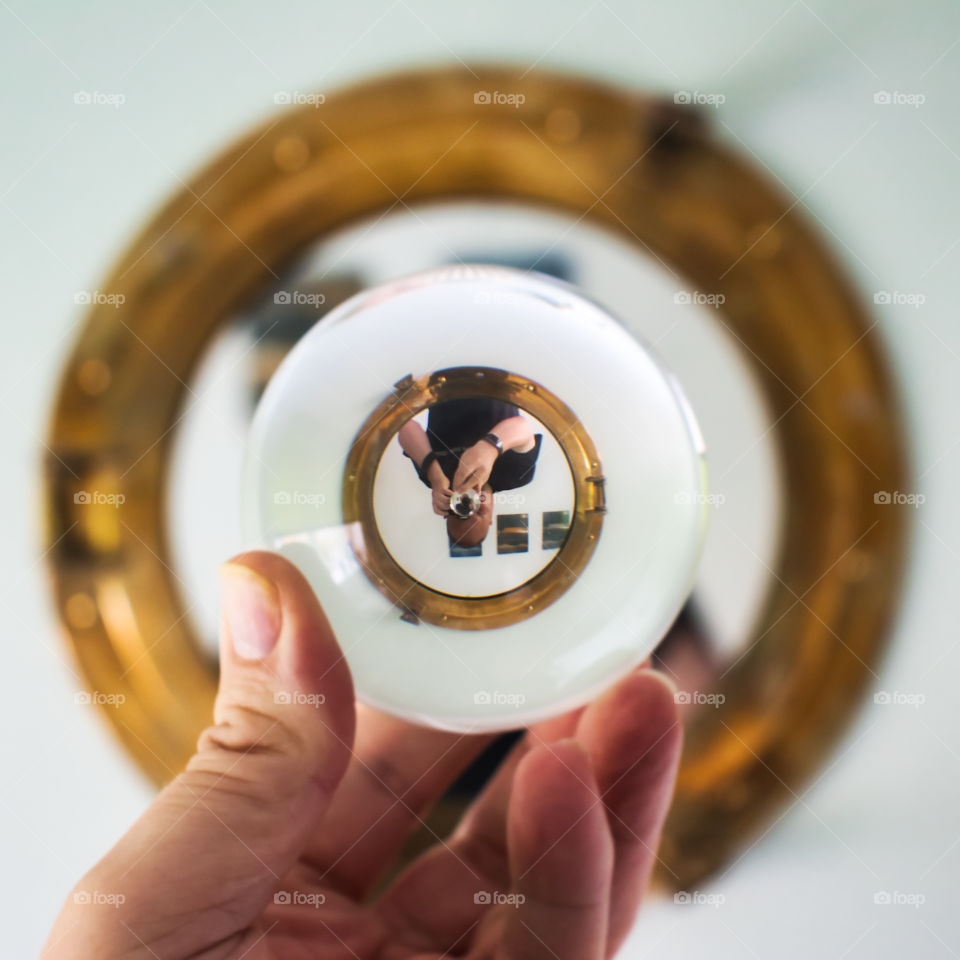 Photo ball in mirror receding circles