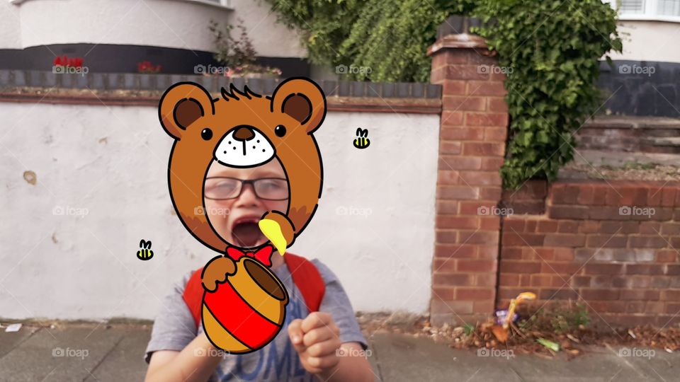 A Picture Of My Awesome Brother Pretending To Be A Bear Eating Honey,have a nice day.