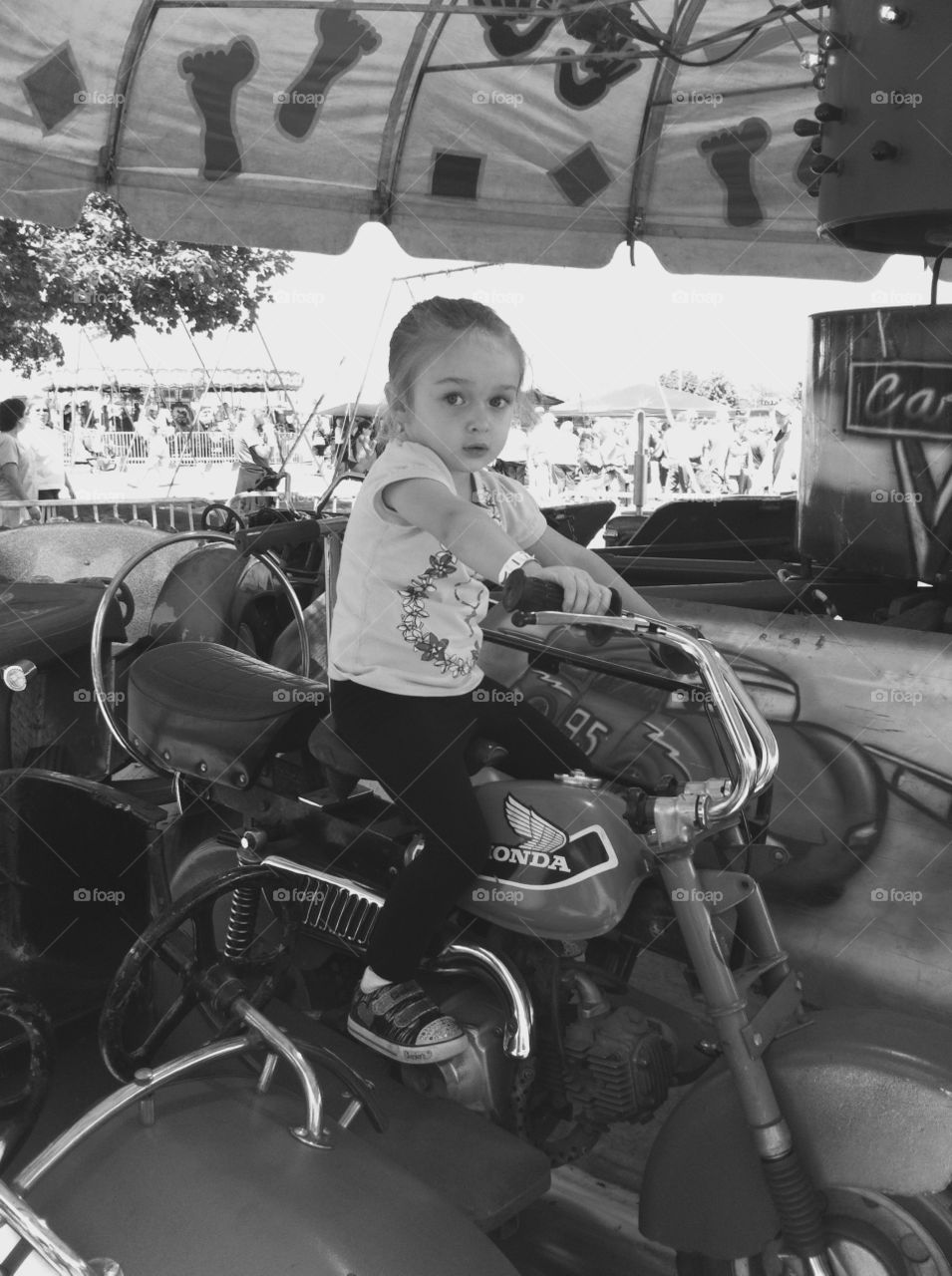 Motorcycle Ride. My daughter on the motorcycle ride at the fair. 