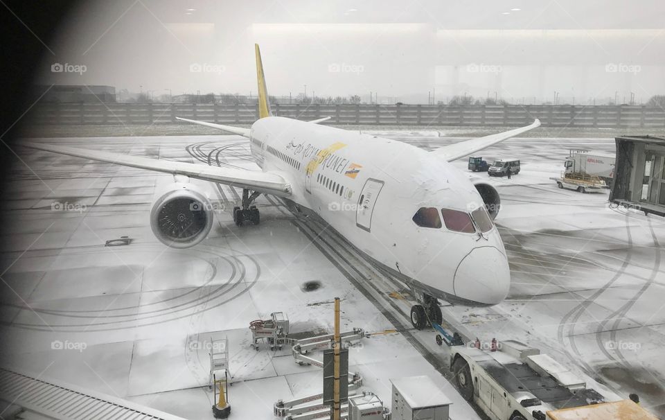 A Royal Brunei Airlines plane at snow covered Heathrow Terminal 4. £20.00