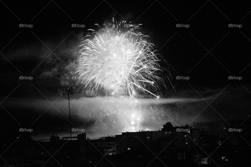 a black and white shot taken at new years if the fireworks over marbella