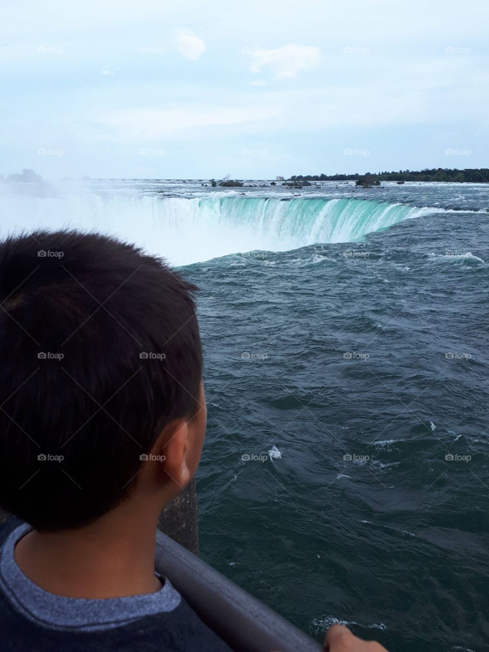 Child looking over Niagara Falls