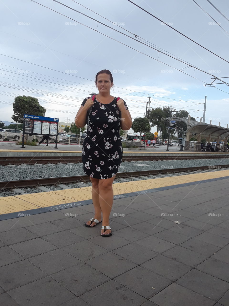 full body curvy woman selfie at trolley stop