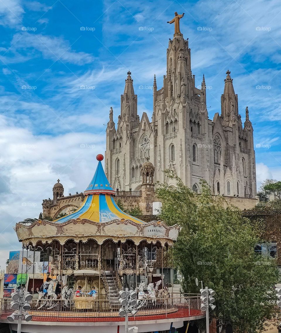 Amusement park in Barcelona, on the Tibidabo hill near a church overlooking the city