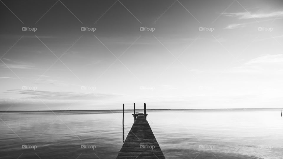Empty wooden pier on sea