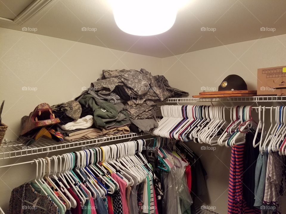 Clothes and other items pile up in the closet before moving.
