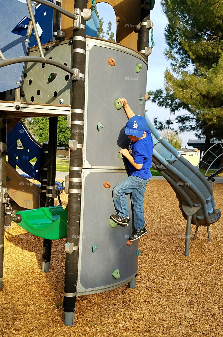 Boy on climbing wall!