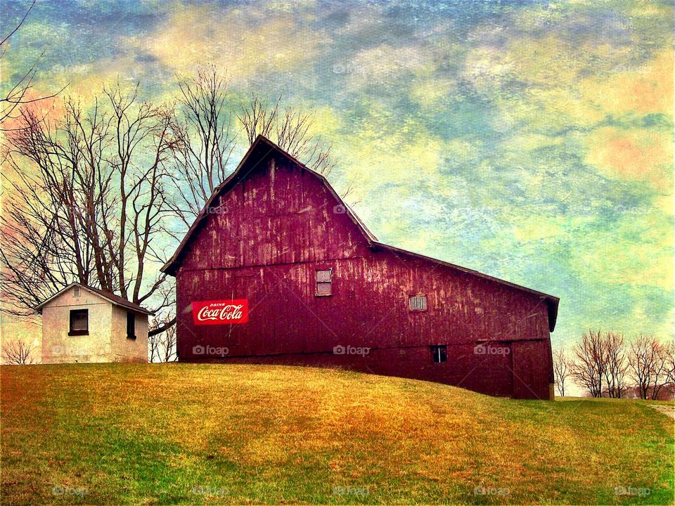 Beautiful old Indiana brown barn with coke sign on it. 