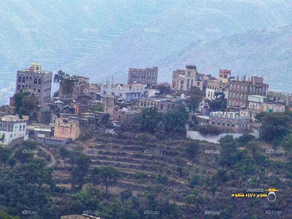 A stunning view of green mountains covered in fog in Yemen