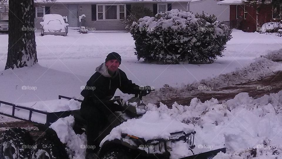 snowblowing. my husband clearing the driveway