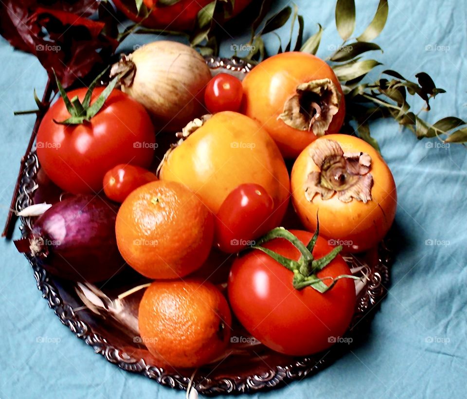 Fruit and vegetables on a silver plate