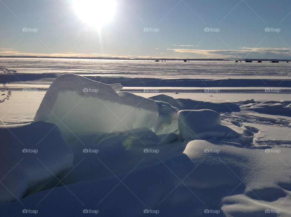 Alberta frozen lake ice burg sunset