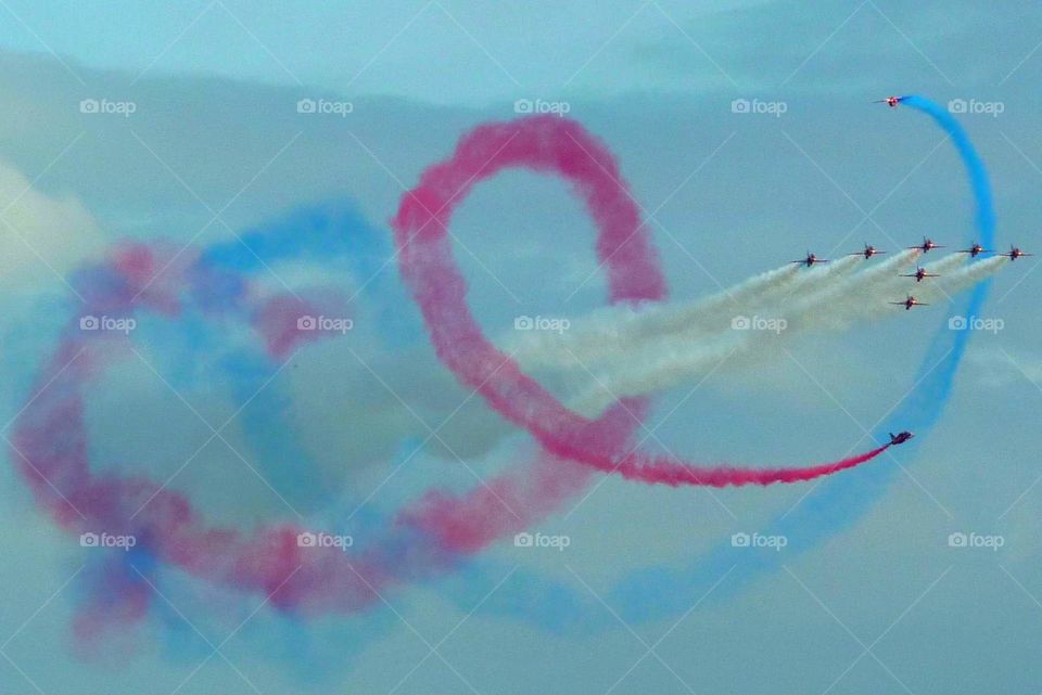 red arrows colourful smoke loop formation
