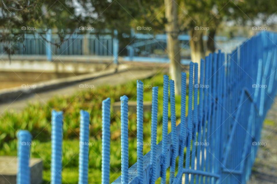 blue fence made of rebar