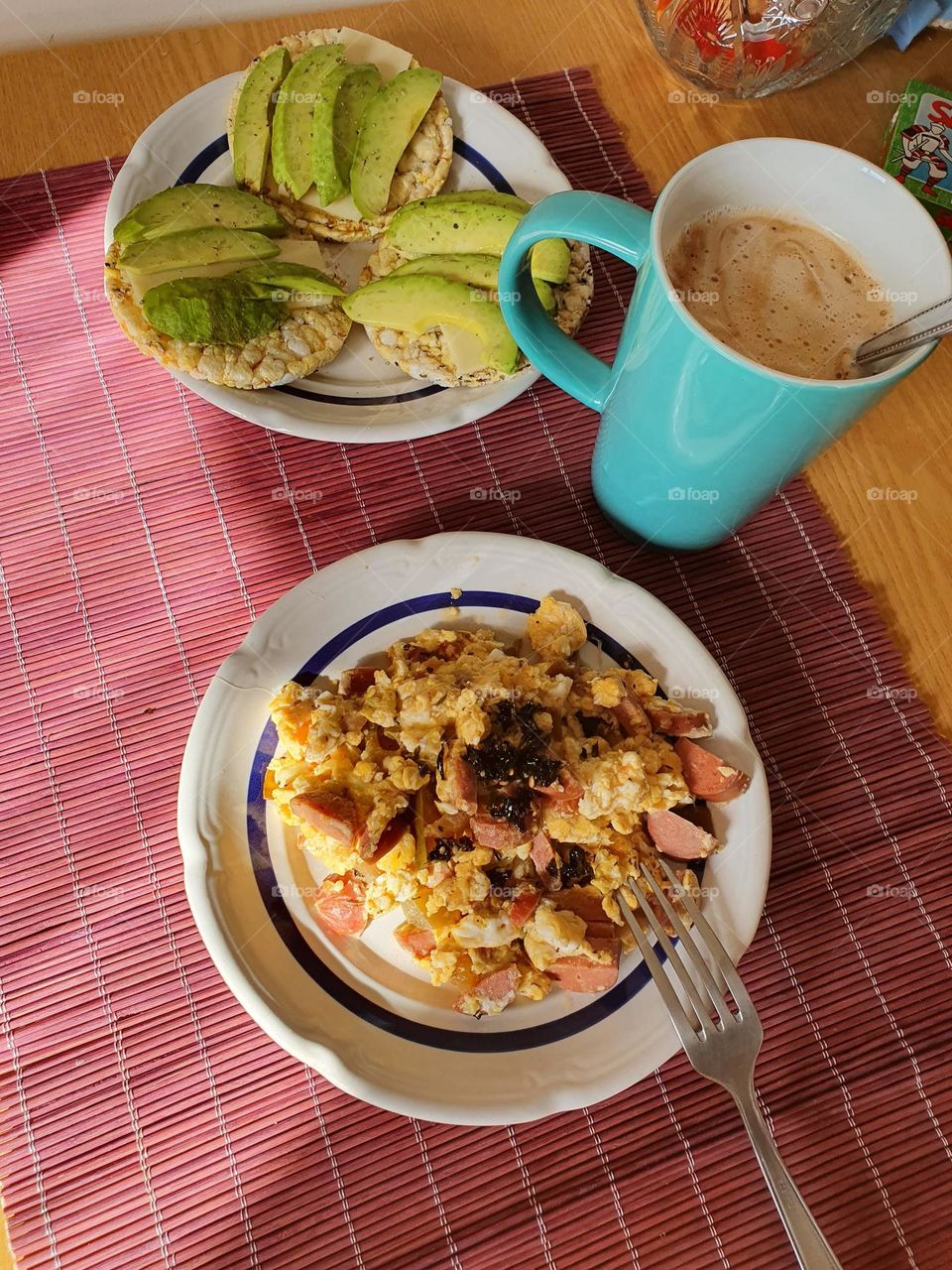 Breakfast time with some eggs and avocado.