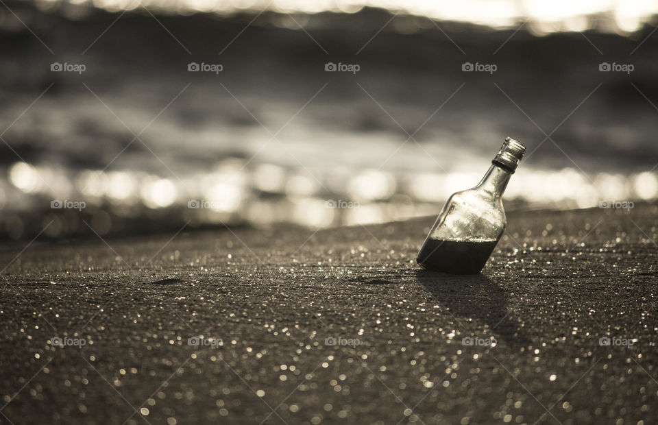 Bottle in sand