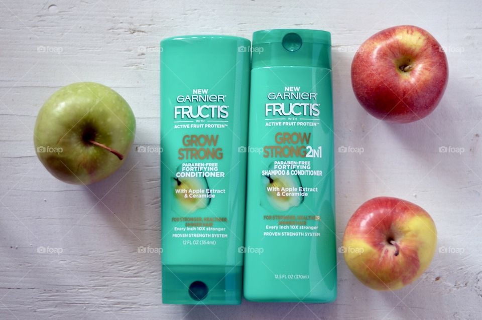 Garnier grow strong conditioner and shampoo Flat lay on a white background