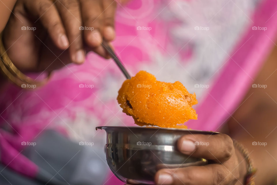 Close-up of female hands holding sweet food