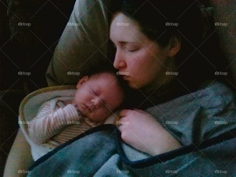 Mother sleeping with baby
