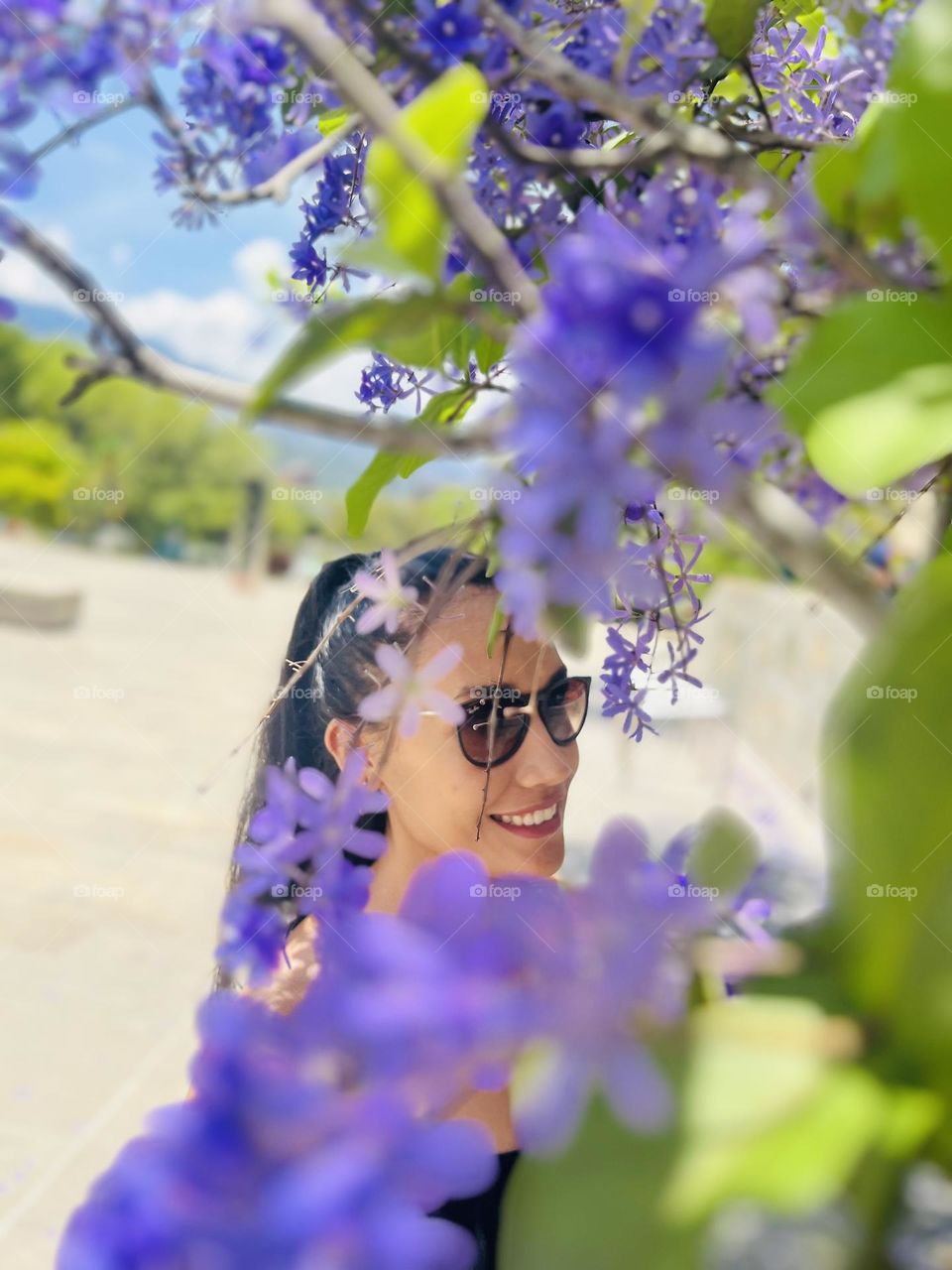 A woman behind the flowers 