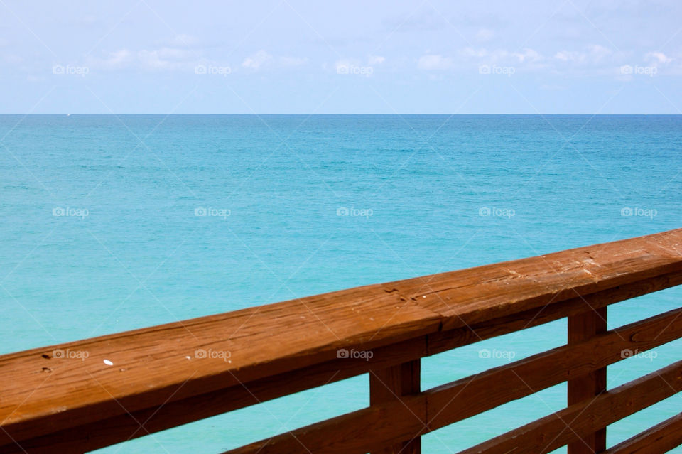 ocean water dock fishing by refocusphoto