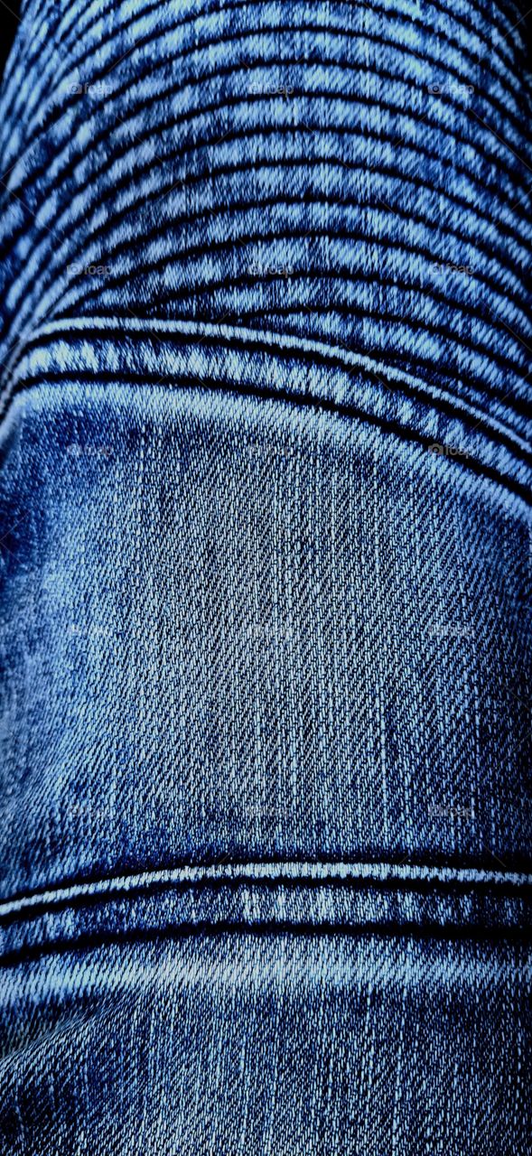 Color vs black and white: Closeup view to abstract space of empty blue natural clean denim jeans texture.