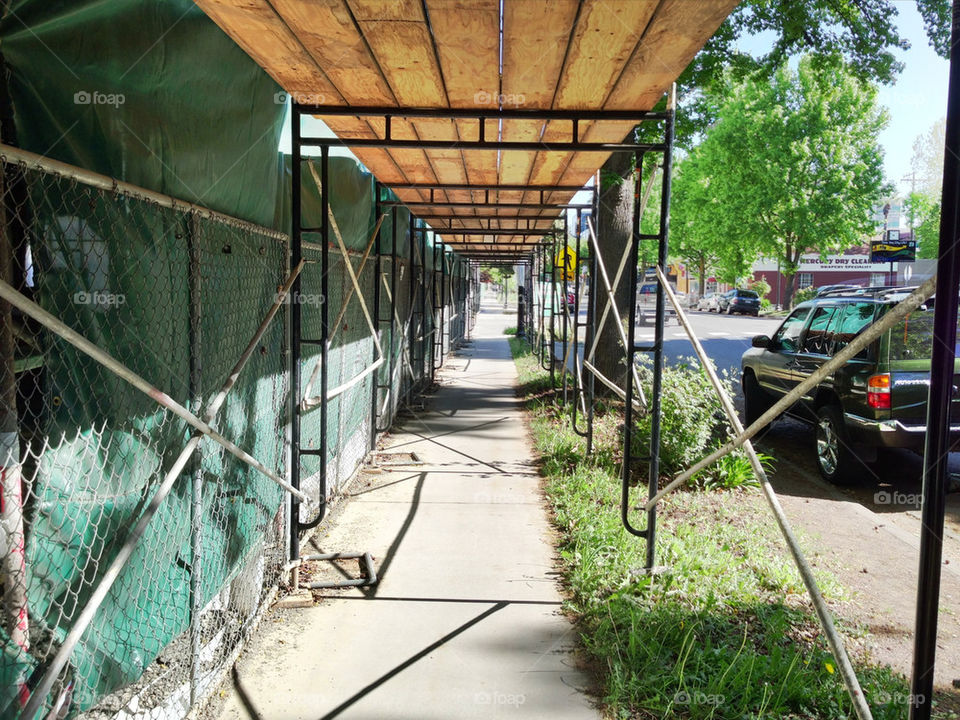 Scaffolding set up over sidewalk 