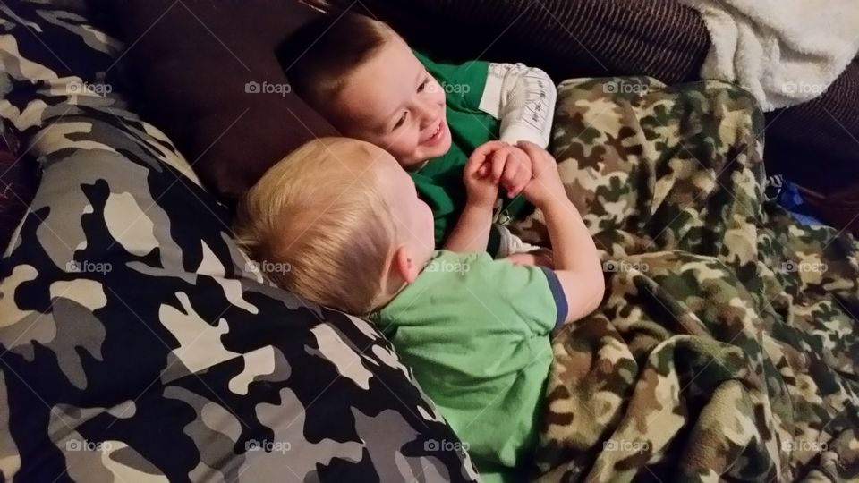 brothers holding hands