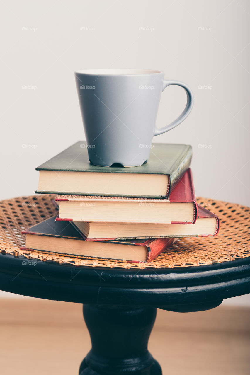 A few books with cup of coffee and cookies on wooden floor. Time for relax. Spending leisure time on reading. Cozy and comfortable. Learning from books 📖Studying for the next exam 😌