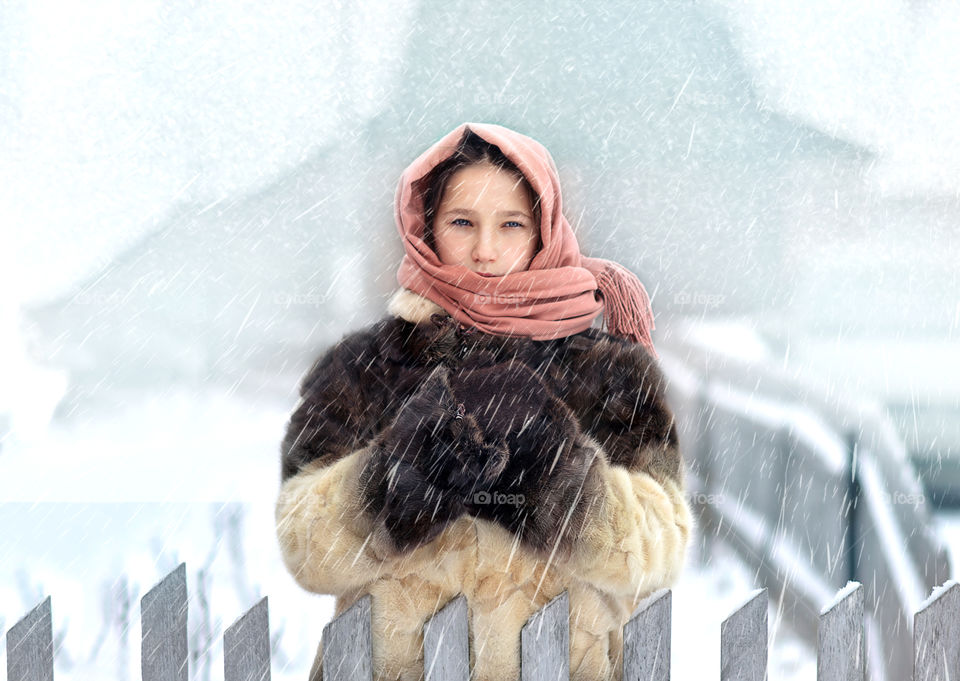 girl in winter in a snowstorm